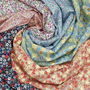 Different colour ditsy floral prints displayed in a swirl