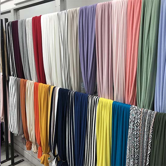 Stripes, pattern designs and different colour fabric lengths on display.