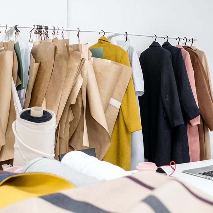 Patternmaker's rail with completed patterns and coat samples